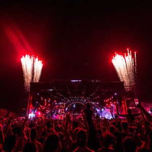People Gathering Near Stage With Fireworks